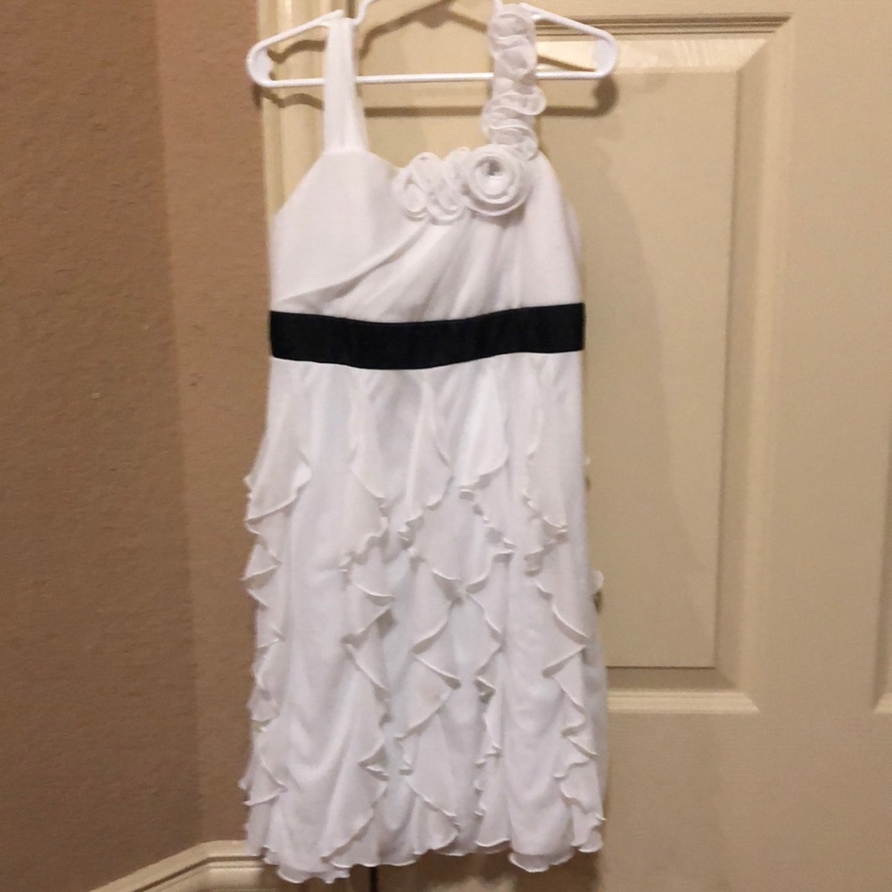 A white dress with flowers on a strap